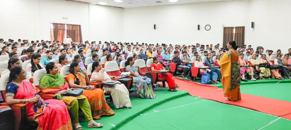 a group of people sitting in chairs in a room